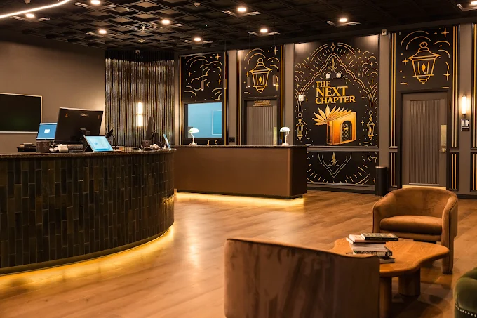 The Next Chapter Market — finished retail interior and branded feature wall